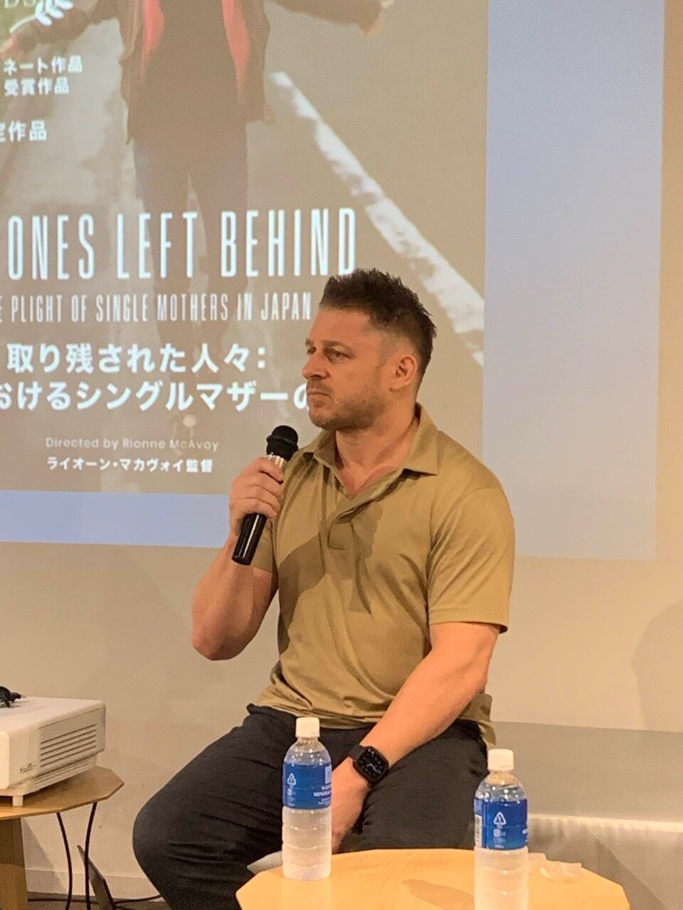 Rionne McAvoy speaking on a panel about his documentary work